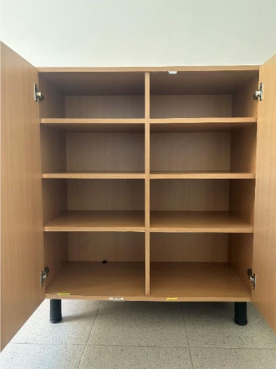 A wooden cabinet with many compartments
AI-generated content may be incorrect.